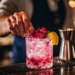 An elegant bartender preparing an Azalea Cocktail with gin and elderflower liqueur, garnished with azalea flowers and a lemon twist in a sophisticated bar setting.
